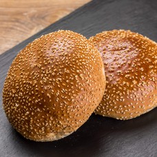 Freshly baked hamburger bun with sesame seeds 100 g